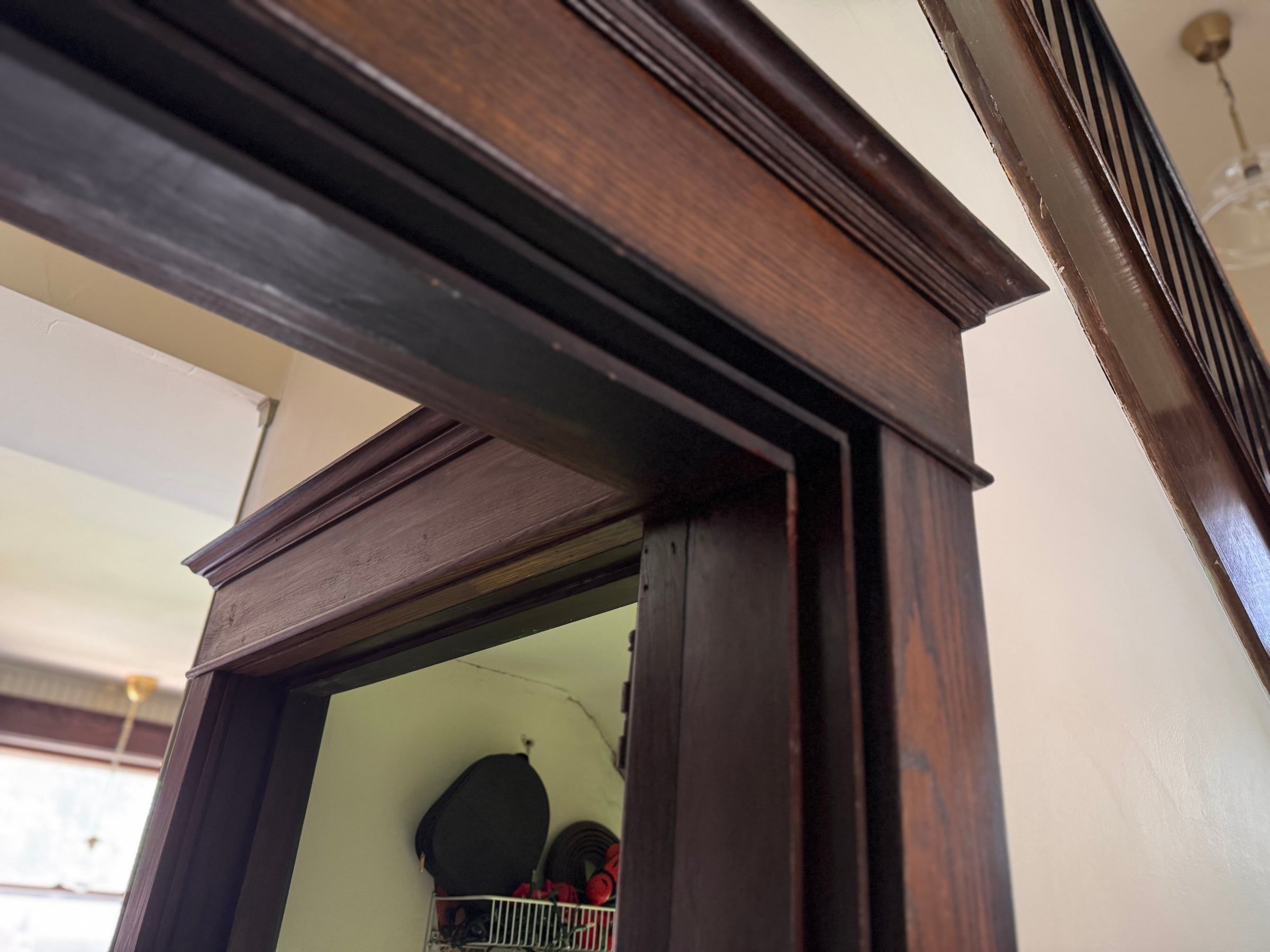 Looking up at a doorway head, showing the layered profiles of the five-piece casing